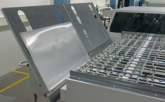 Plate stacker with trolleys for VCP/RAO